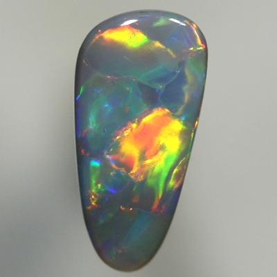 SOLID BLACK OPAL Large rolling flashes, red to gold to green